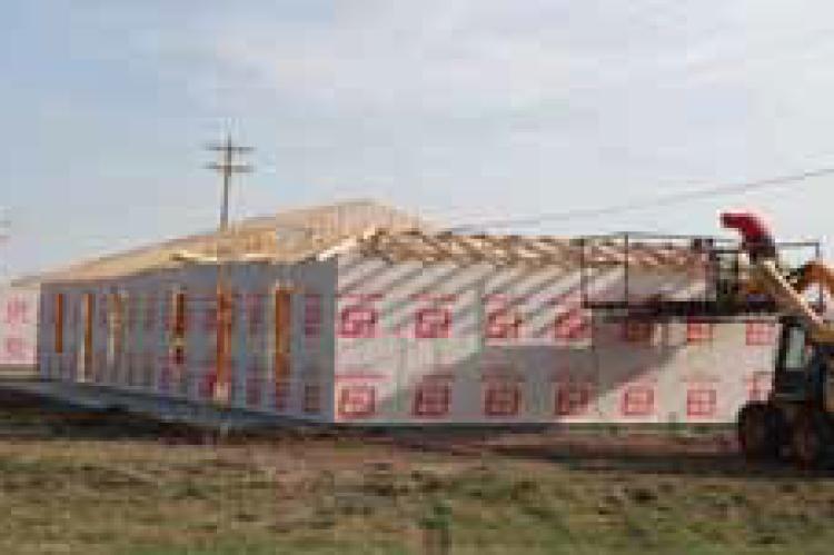 Work on new houses moves forward Tuesday morning on the southern edge of Ellsworth.