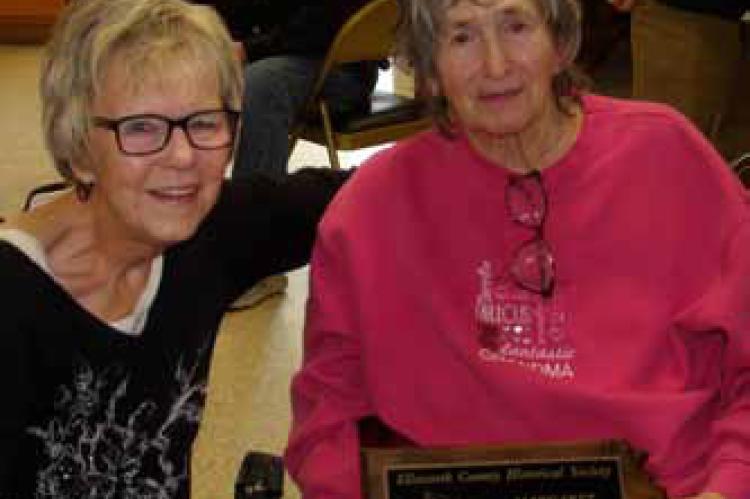 Ellsworth County Historical Society Board President Cynthia Edgerle, left, presents Margaret “Mugs” Kepka with the 2025 Historian of the Year award. ALAN RUSCH/Ellsworth County Independent-Reporter