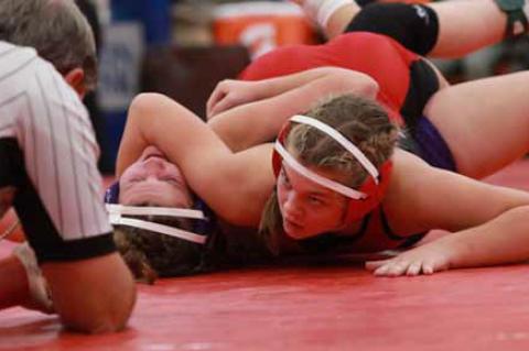 Ellsworth’s Sophie Homolka works to pin Southeast of Saline’s Elizabeth Shaw in the 145-lb. weight class at the Dec. 13 competition in Minneapolis. KAREN BONAR/Ellsworth County Independent-Reporter
