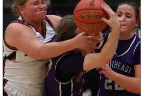 Senior Reagan Hansen battles for a rebound against SES defenders Jan. 30 at home. KAREN BONAR/ Ellsworth County Independent Reporter