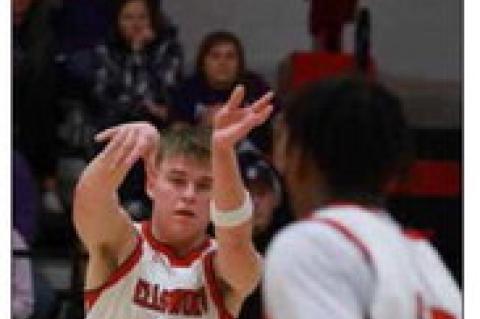 Senior Tucker Goss passes the ball across the court during the Jan. 30 game against SES. KAREN BONAR/Ellsworth County Independent Reporter