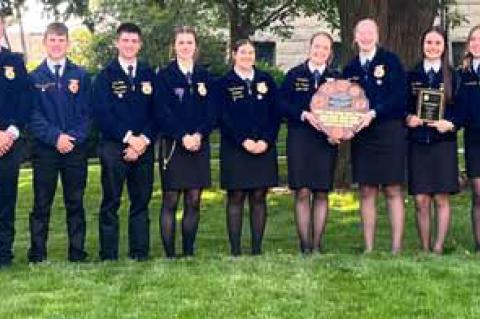 Students, along with advisers Karl Dawn Stover, left, and Kara Quilter, right, attended the Kansas FFA Convention in Manhattan and brought home the top award. Courtesy photo
