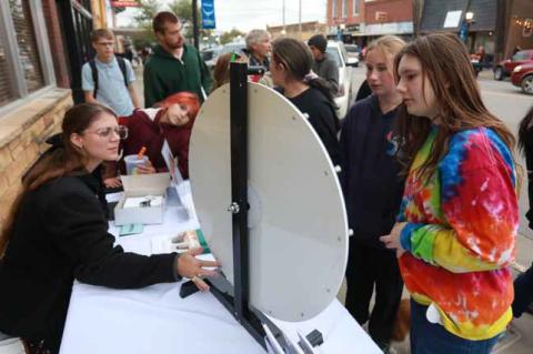 Alyssa Jewell from Central Kansas Mental Health Center interacts with Sunni Kralik, right, during Fall Fest Oct. 23 in downtown Ellsworth. KAREN BONAR/Ellsworth County Independent-Reporter