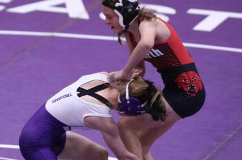 Khloe Kinsley, right, competes against SES wrestler Makenzie Tiller in the 100-lb. weight class.