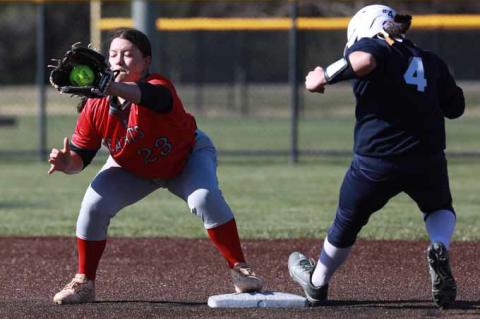 Miley Rolfs successfully secures an out during Game 1 at Sacred Heart March 27 in Salina. KAREN BONAR/Ellsworth County Independent-Reporter