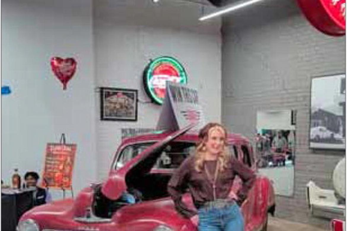 Amelia Fosdick with the 1943 Dodge sedan she won at a fundraiser at The Garage in Salina Feb. 14. The sold-out event generated almost $25,000, which will go toward an expansion project to build on to the shop and station at The Garage. Courtesy photo