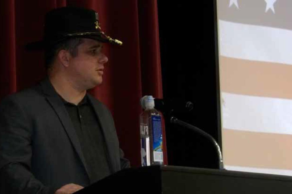 U.S. Army Capt. Jacub Bruning (2013-2020), 2009 graduate of Ellsworth Jr./Sr. High School, gives the Veterans Day speech Nov. 11 in the school’s Performing Arts Center. He wears the standard head gear of the Army Cav, the famous Army Stetson, which he w