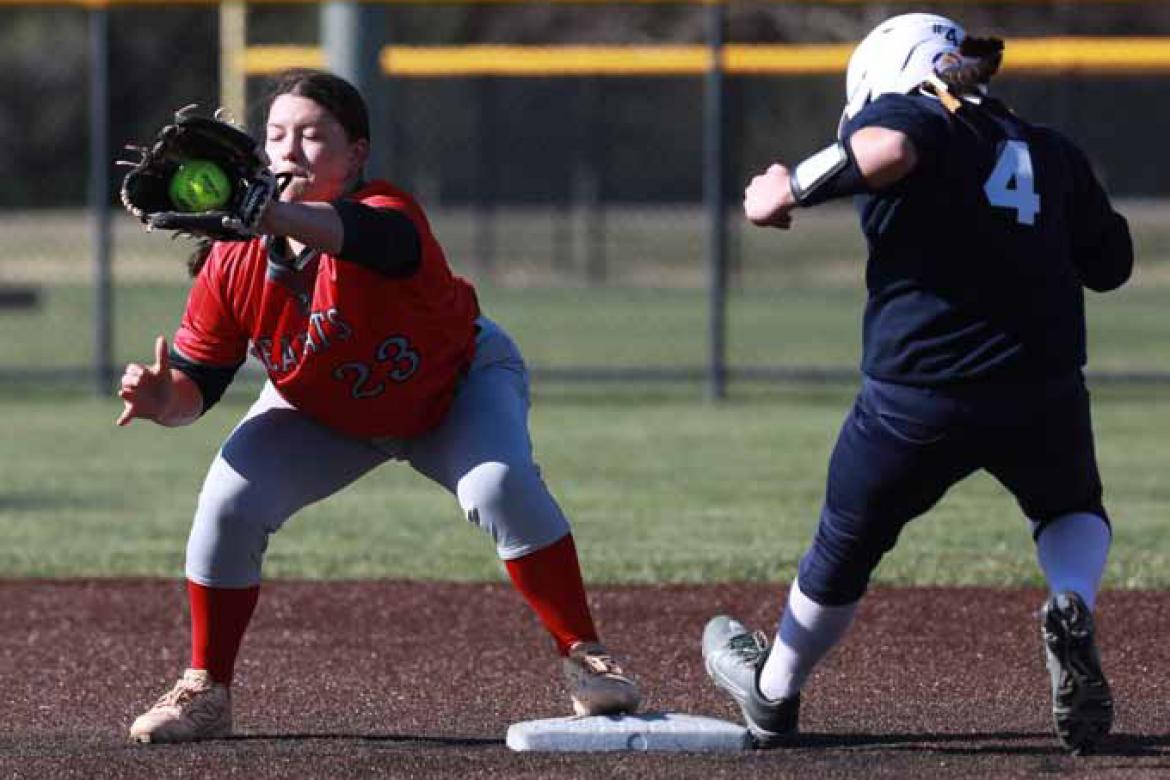 Miley Rolfs successfully secures an out during Game 1 at Sacred Heart March 27 in Salina. KAREN BONAR/Ellsworth County Independent-Reporter